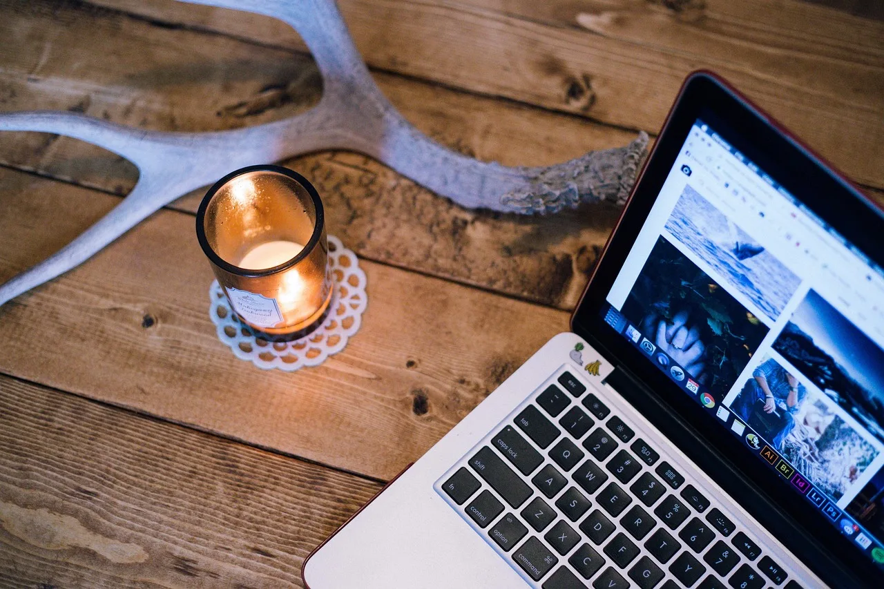 antler, candle, computer, laptop, screen, table, wood, brown computer, brown laptop, brown wood, brown table, brown candle, brown candles. Creator tools for a membership community, compared before you commit