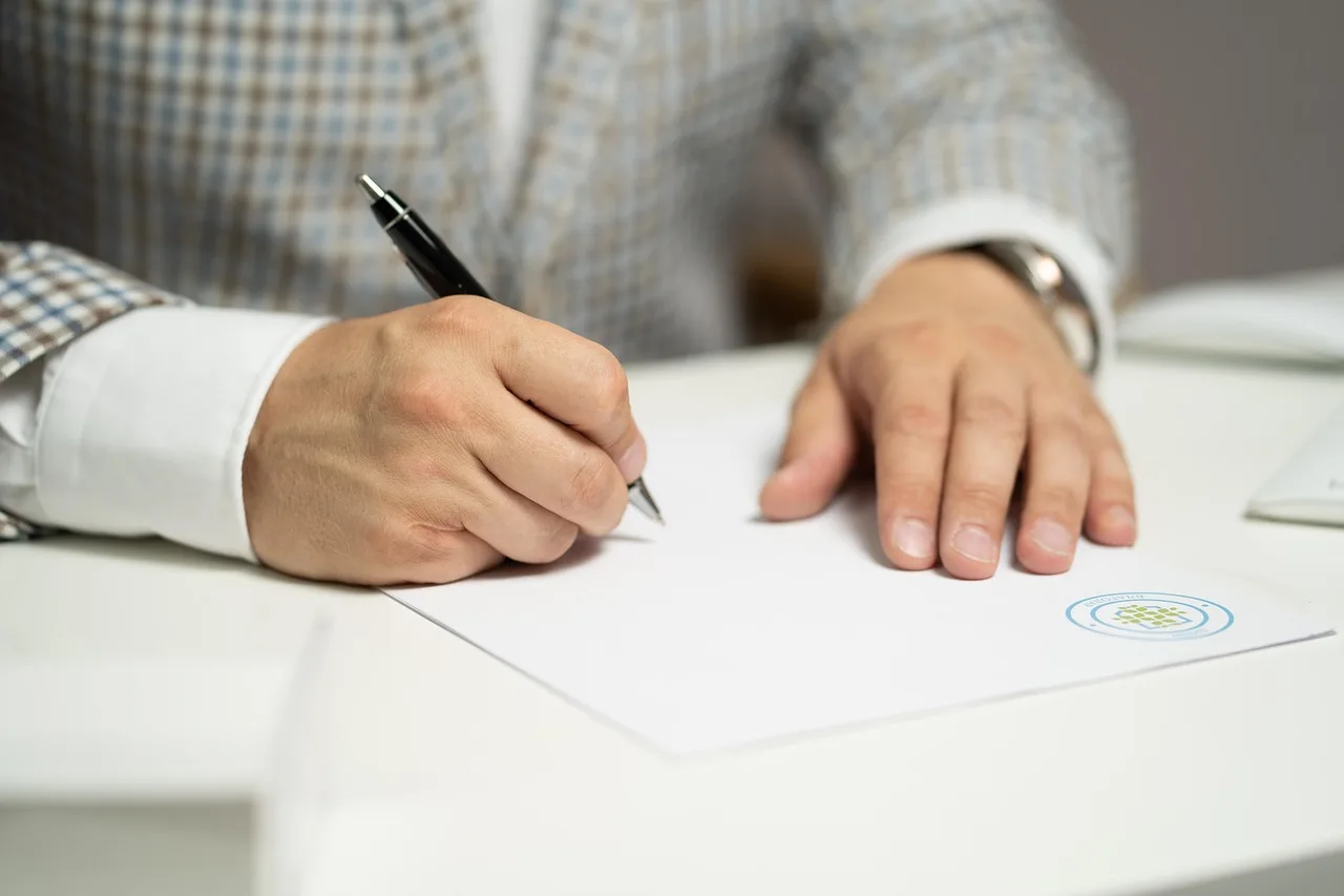 man, sign, paper, write, document, contract, signing, agreement, signature, signing document, signing contract, signing paper, sign, contract, contract, contract, contract, contract, signing, agreement, signature, signature. Sponsor contract clauses that decide what the deal is worth