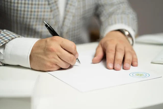 man, sign, paper, write, document, contract, signing, agreement, signature, signing document, signing contract, signing paper, sign, contract, contract, contract, contract, contract, signing, agreement, signature, signature. Sponsor contract clauses that decide what the deal is worth